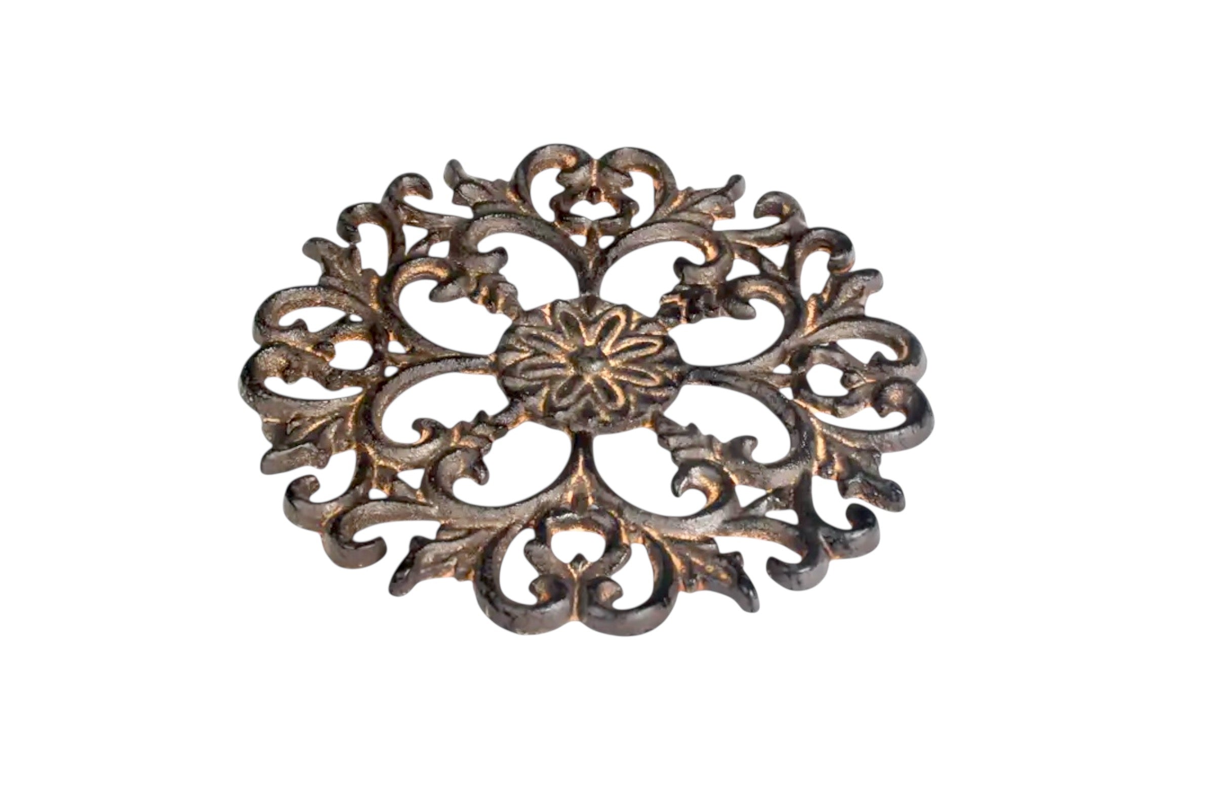Acanthus design metal trivet pictured lying down on its base, against a white background.