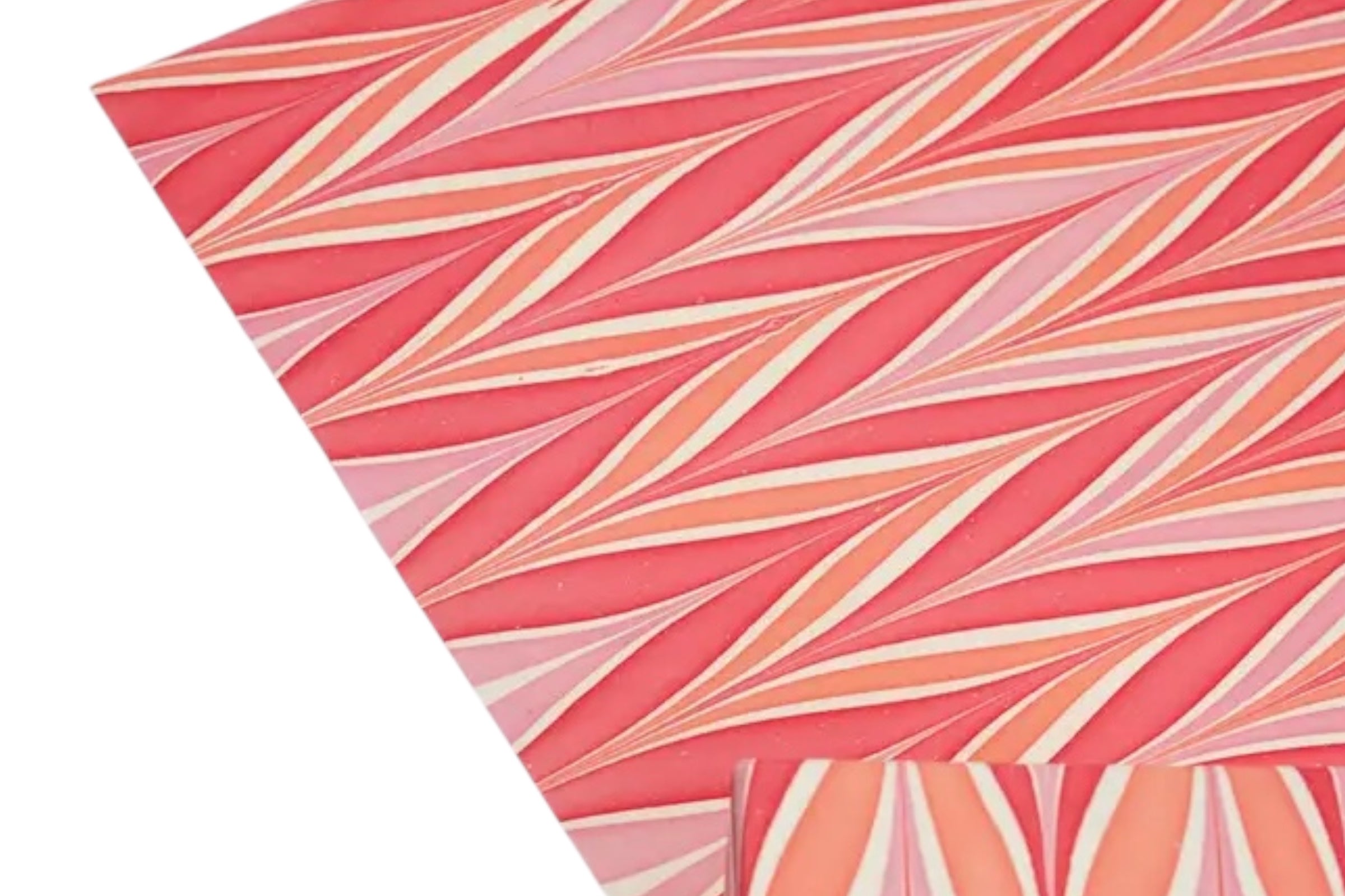 Some handmade, candy stripe design wrapping paper on a white background.