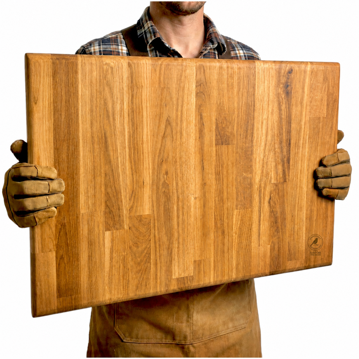 Carpenter holds a large solid oak chopping board.