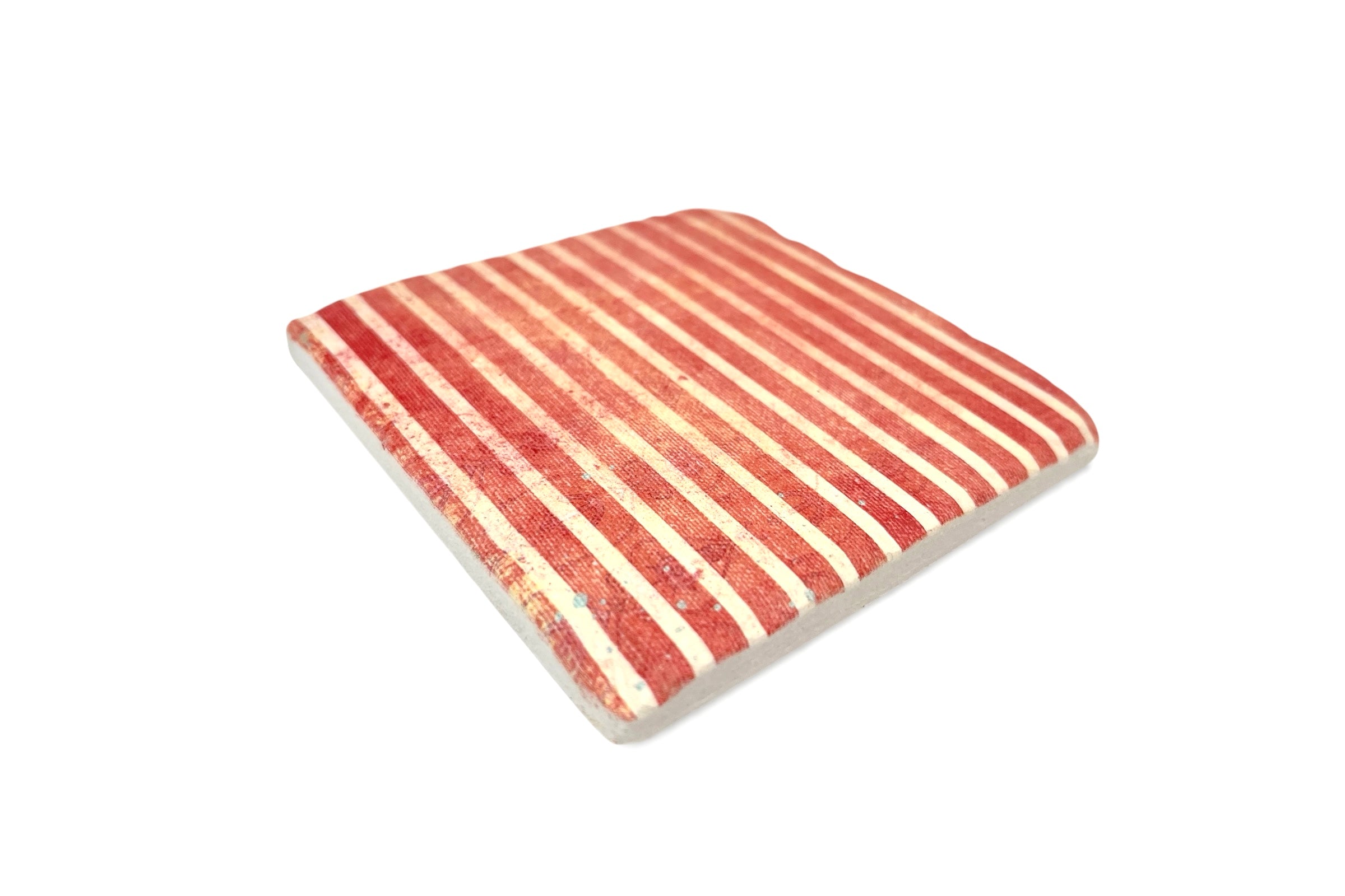 Striped red and beige coaster on a white background