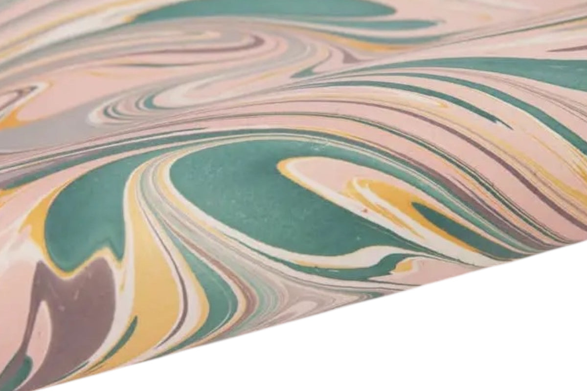 FINCHCRAFT rose quartz hand marbled wrapping paper with flowing teal and neutral patterns on textured cotton paper.