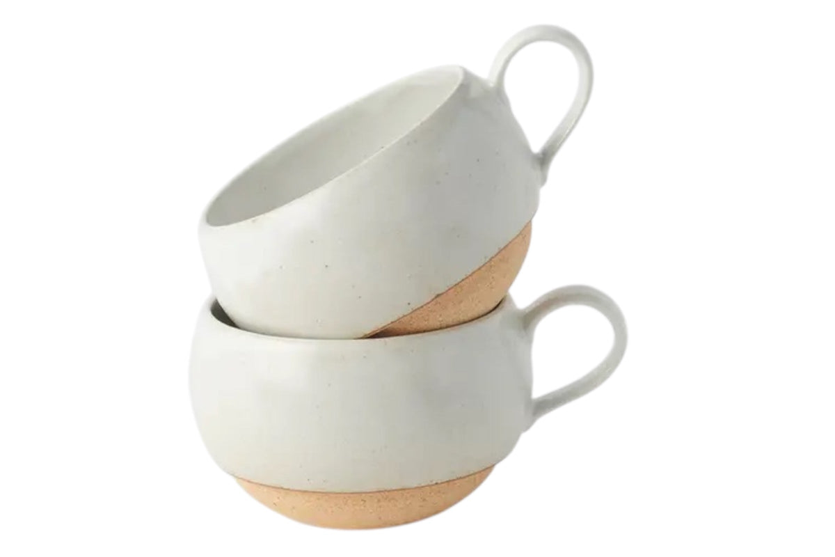 FINCHCRAFT rounded white earthenware mugs stacked, featuring a smooth glazed finish and exposed clay base.