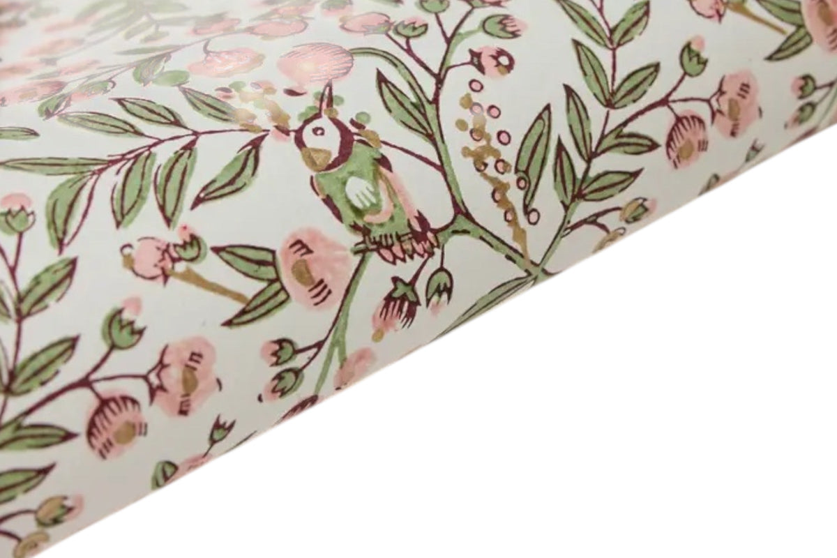FINCHCRAFT blush pink and sage green cotton wrapping paper featuring a hand block printed songbird and floral motif.