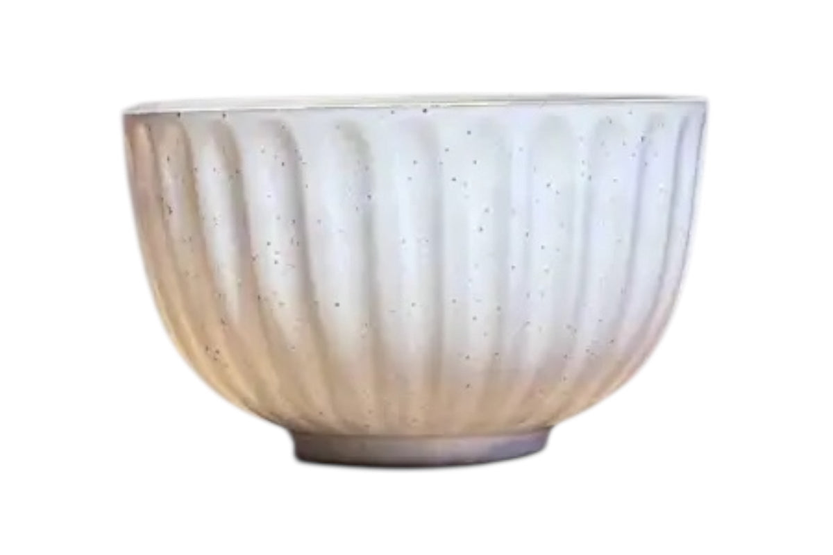 FINCHCRAFT speckled white ceramic teacup with a softly ridged exterior and smooth glazed finish.
