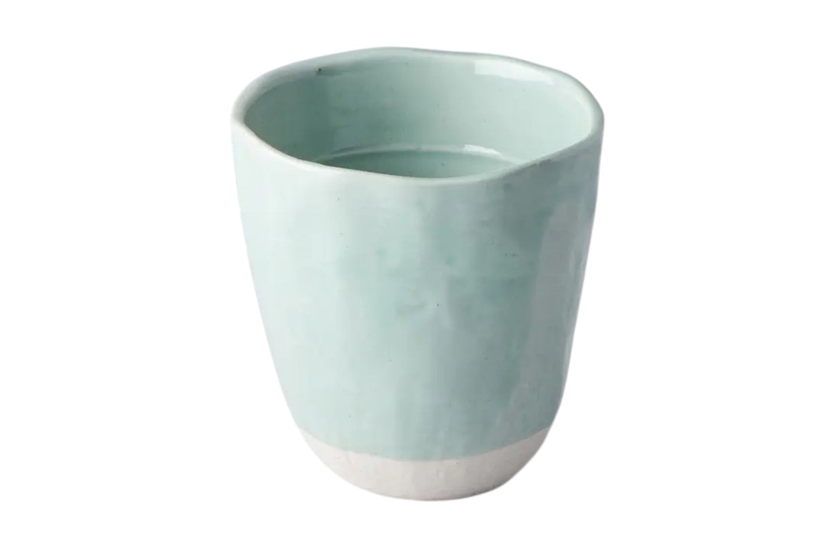 FINCHCRAFT Tomei blue glazed earthenware mug with a unique lopsided, hand-finished irregular shape.