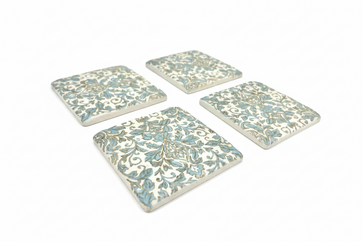 FINCHCRAFT set of four square resin coasters with a light green and white vintage Parisienne botanical pattern.
