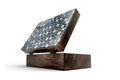 Wooden box with a mosaic top on a white background