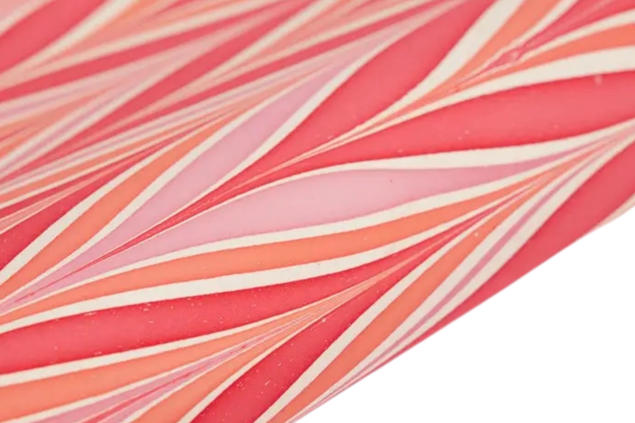 Some handmade, candy stripe design wrapping paper on a white background.
