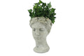 A stone composite planter in the shape of a cherub's head, on a white background.