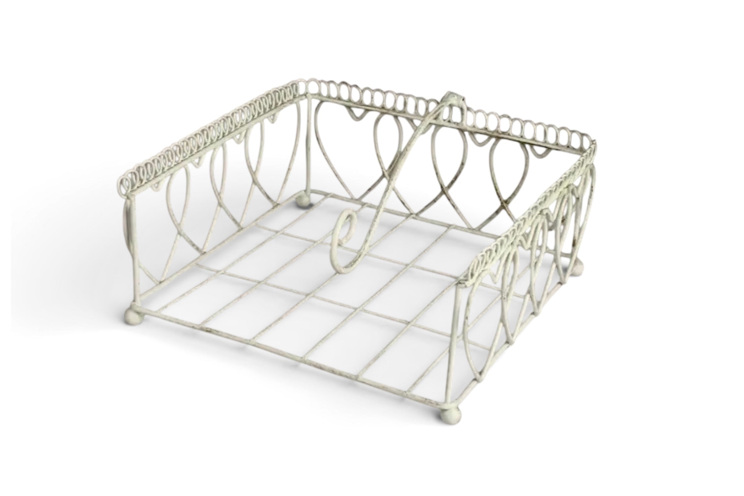 A cream coloured wire napkin holder on a white background.