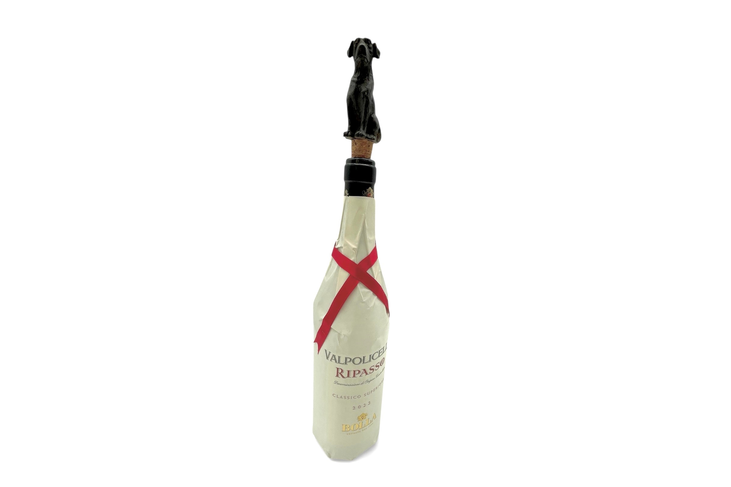 Wine bottle with a decorative stopper on a white background