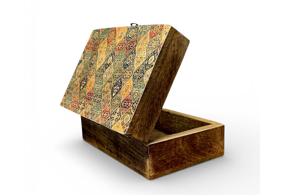 Wooden box with patterned lid on a white background