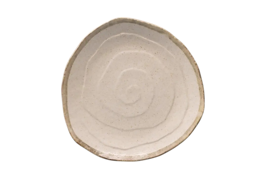 A 27cm porcelain dinner plate with an organic outline and soft flax-toned glaze. Set against a white background.