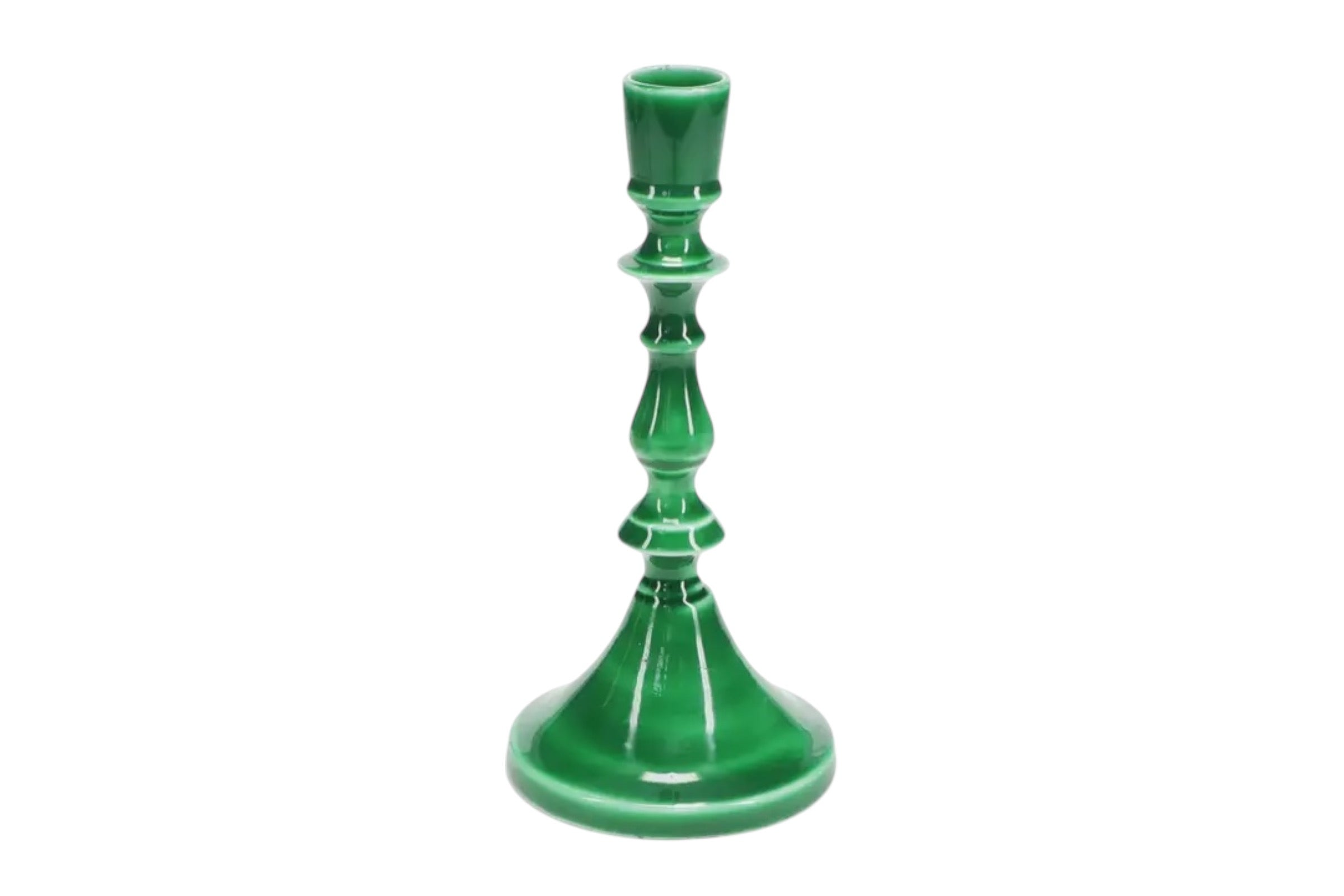 A 19cm enamelled metal candlestick in dark green, with a shaped stem, pioctured against a white background.