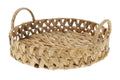 A circular tray woven from natural water hyacinth with integrated handles. Set against a white background.