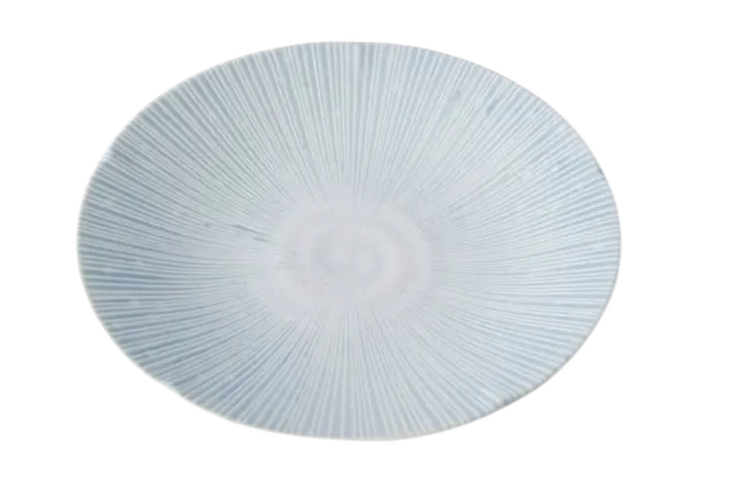A 24.5cm porcelain dinner plate with an ice blue glaze and subtle embossed detail. Set against a white background.
