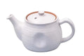 A white speckled japanese teapot with a ridge design, set against a white background.