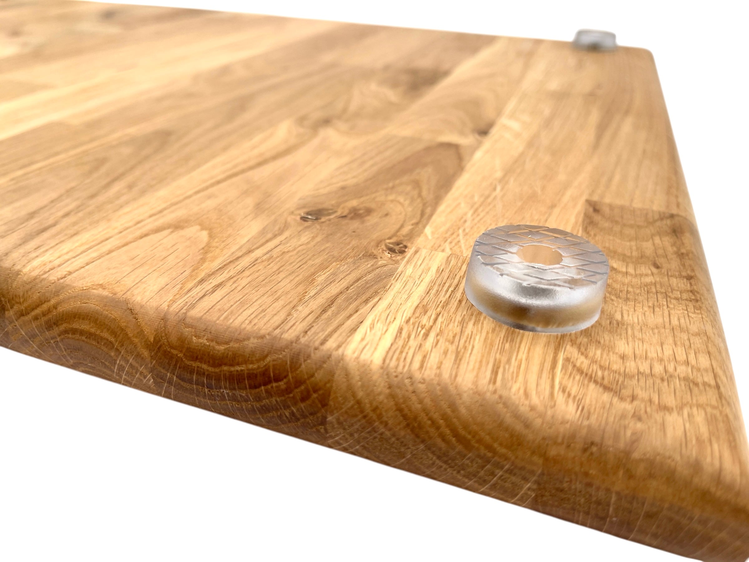Underside of a large oak worktop saver with a clear acrylic foot, on a white background