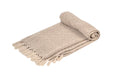 An oatmeal coloured handwoven cotton throw, folded, on a white background.
