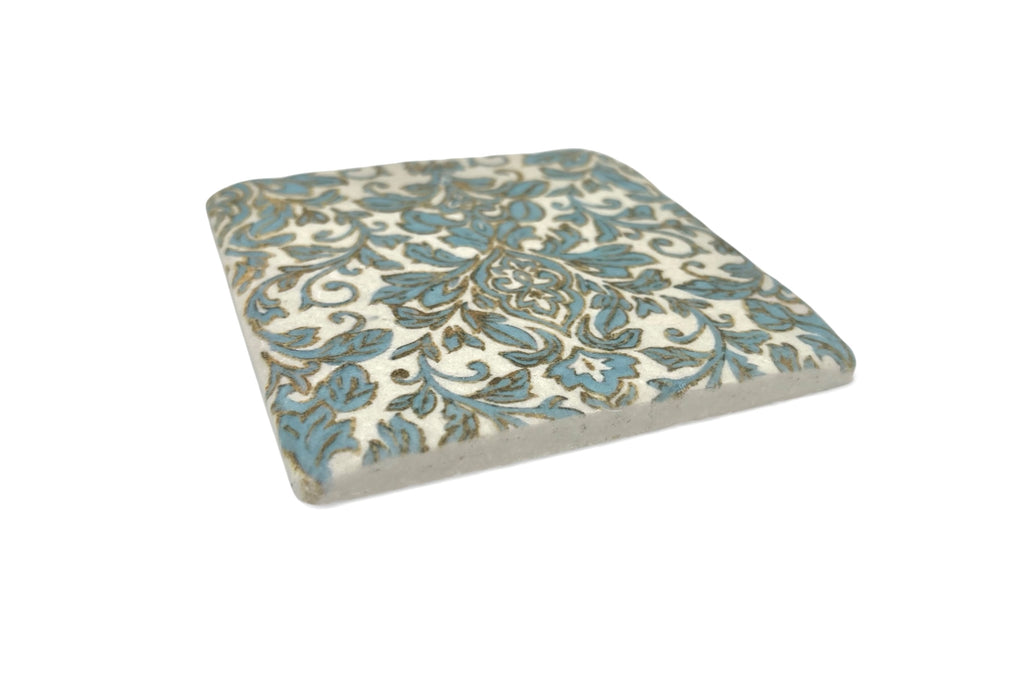 Decorative coaster with floral pattern on a white background