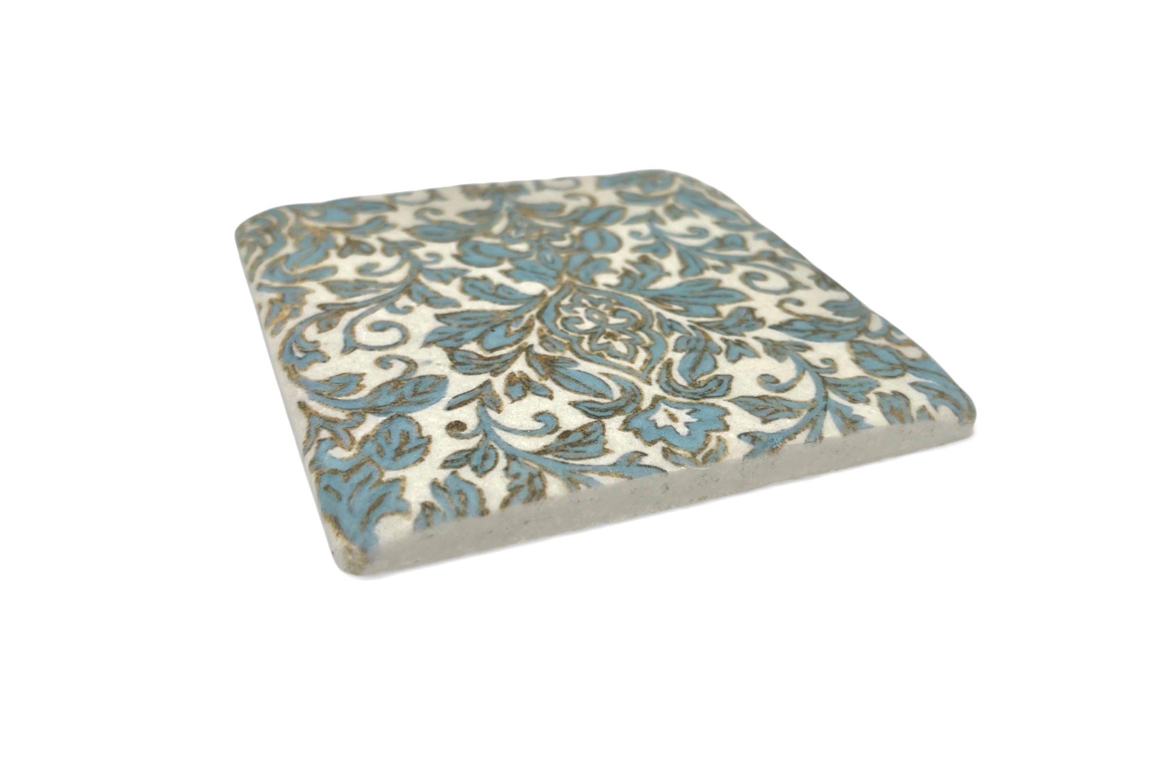 Decorative coaster with floral pattern on a white background