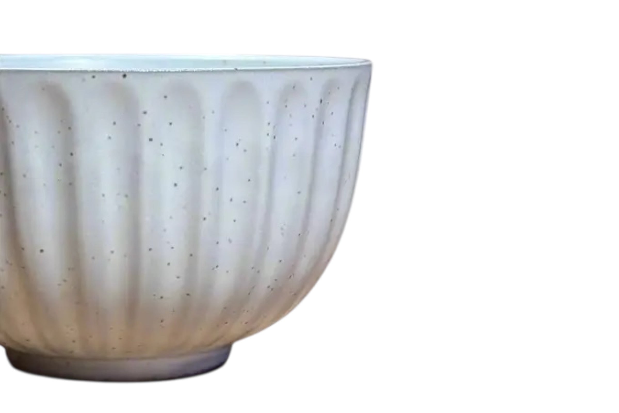 A cut off picture of a white flecked japanese teacup with a ridged design, set against a white background.