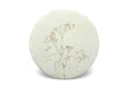 A round botanical design placemat, on a white background.