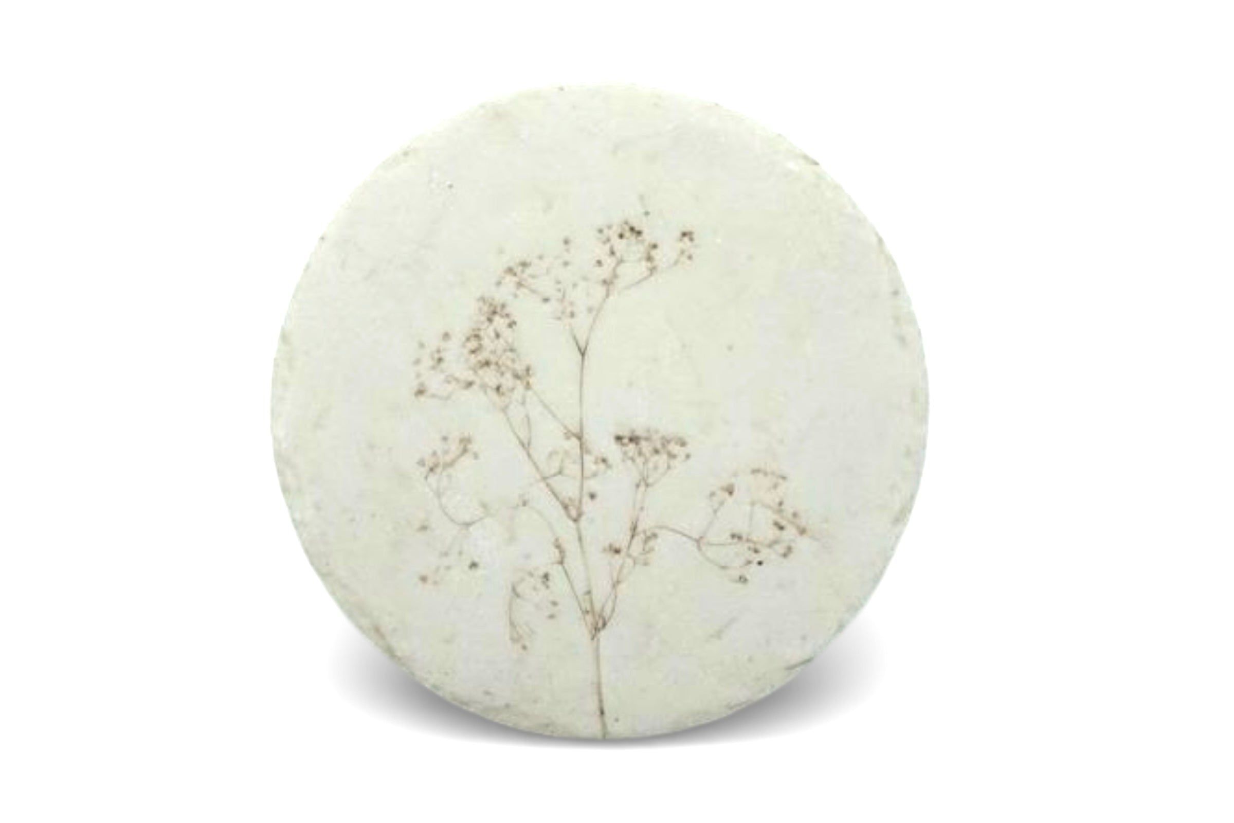A round botanical design placemat, on a white background.