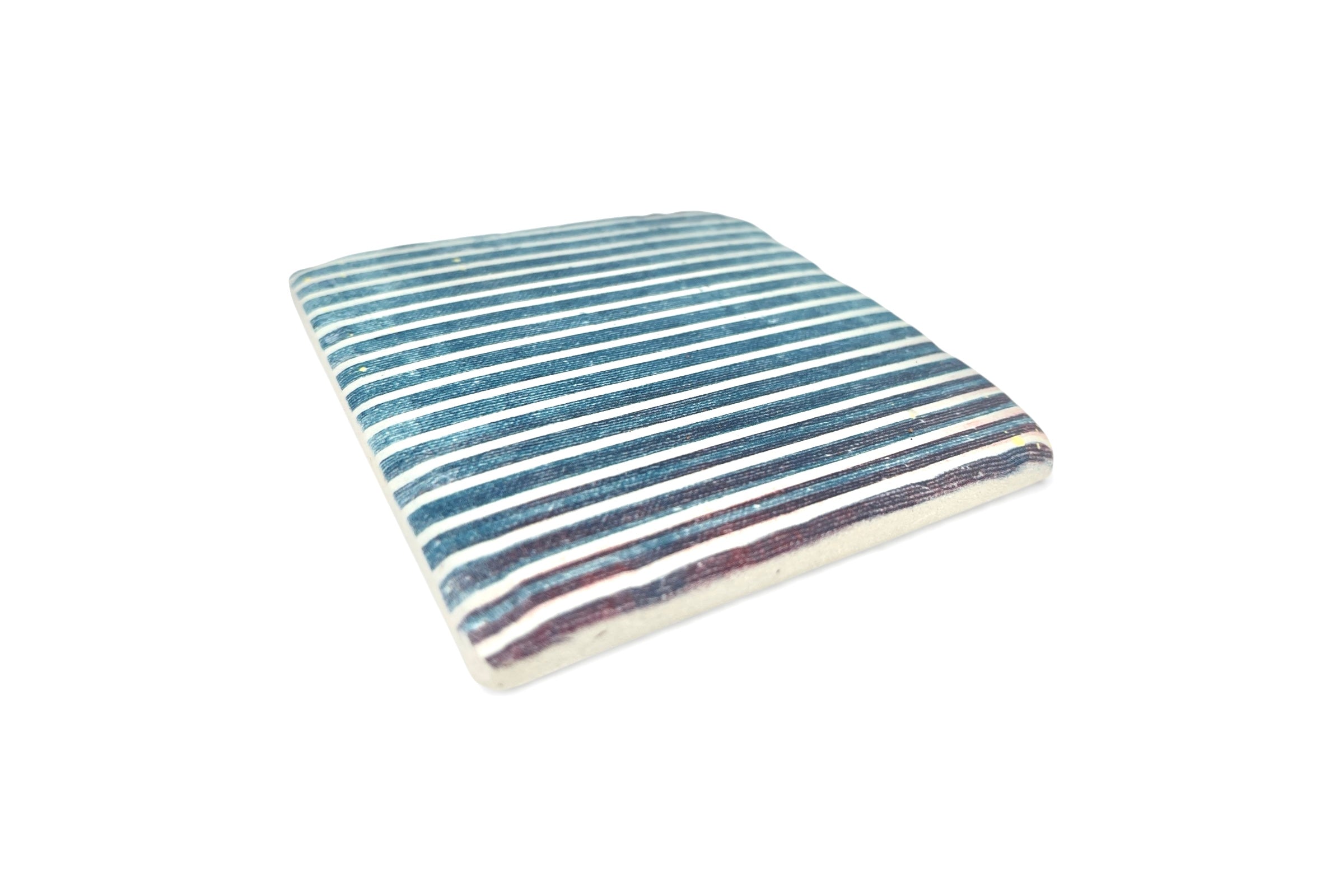 Striped coaster with blue and white stripes on a white background