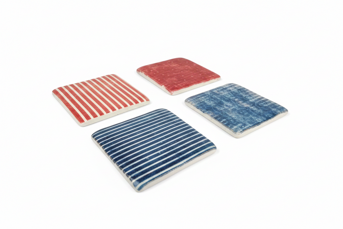 FINCHCRAFT set of four square resin coasters with distressed blue and red botanical and striped patterns