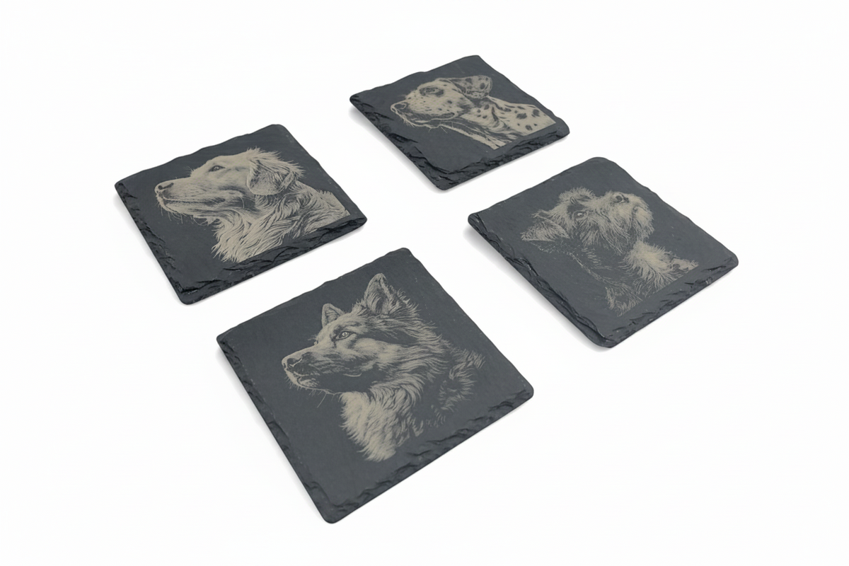FINCHCRAFT set of four square natural slate coasters featuring detailed laser-engraved dog portraits on a matt surface