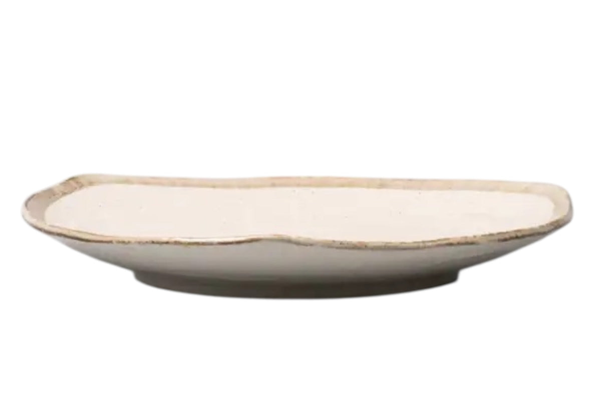 FINCHCRAFT Flax organic porcelain dinner plate with an irregular faceted rim and shallow profile in a neutral tone.