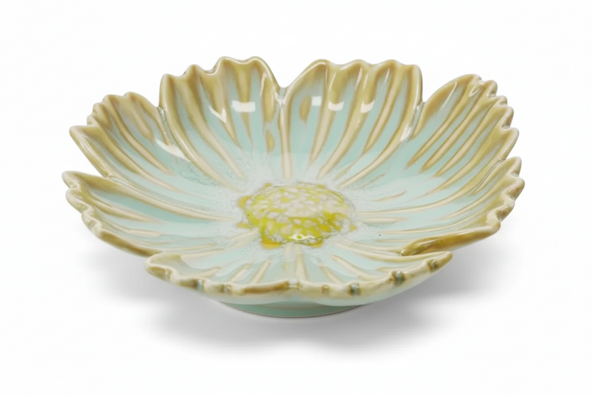 FINCHCRAFT flower-shaped glazed ceramic trinket dish in soft mint green and yellow with a scalloped petal design.