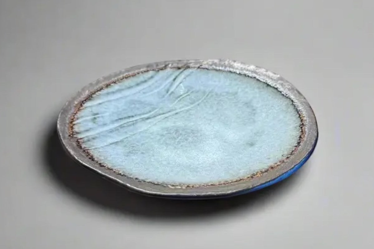 FINCHCRAFT grey glazed stoneware plate with a natural bisque edge and irregular, hand-finished form.