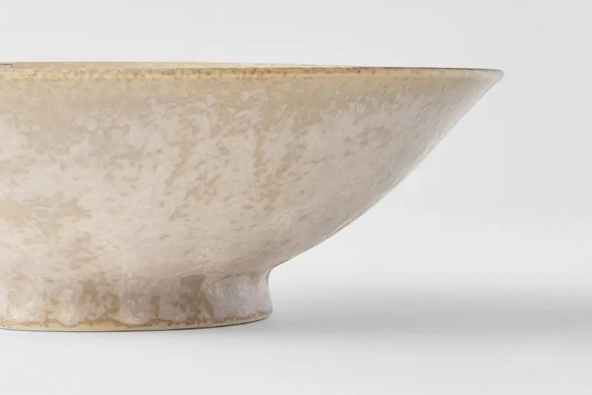 FINCHCRAFT Minoyaki porcelain ramen bowl with a matte white fade glaze and speckled texture in a side profile view.
