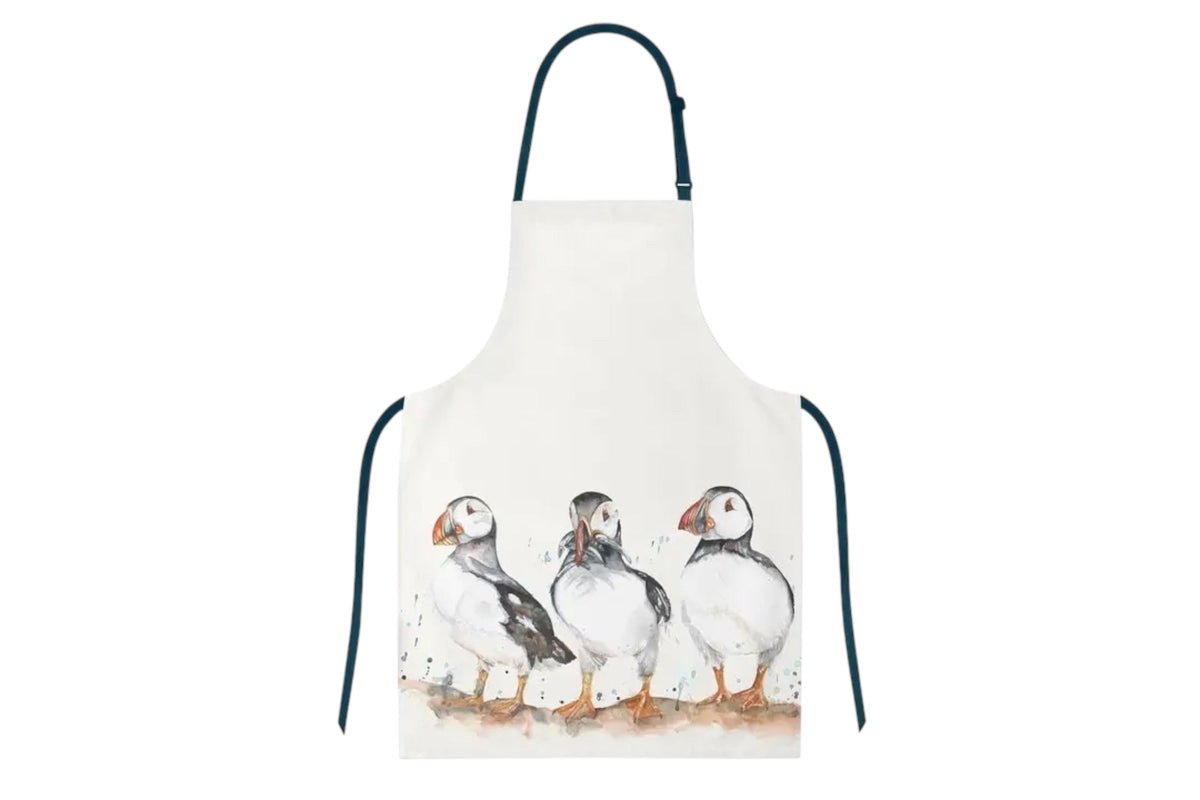 FINCHCRAFT cotton apron featuring a soft watercolour illustration of three puffins on a white background.