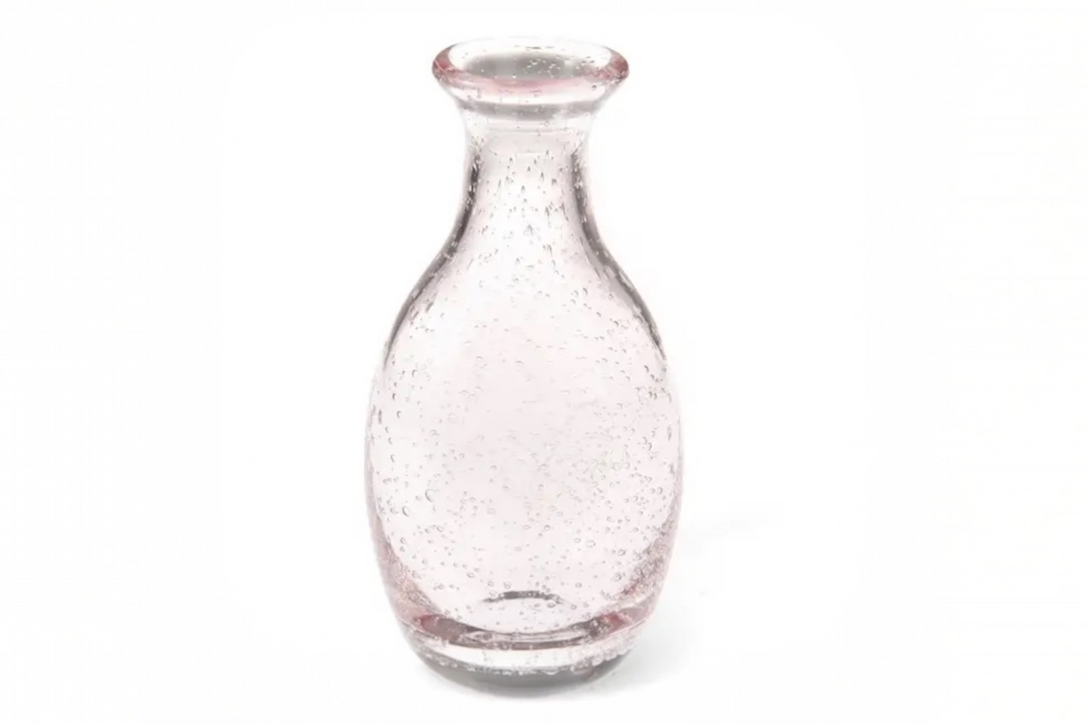 FINCHCRAFT hand-blown rose pink glass bud vase with a rounded body, narrow neck, and delicate air bubble texture.