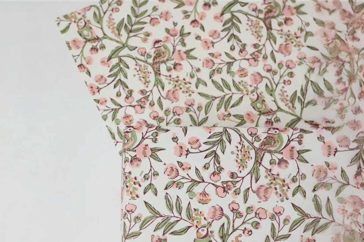 FINCHCRAFT Songbirds Blush cotton wrapping paper with hand-block printed floral, leafy branch, and bird motifs.