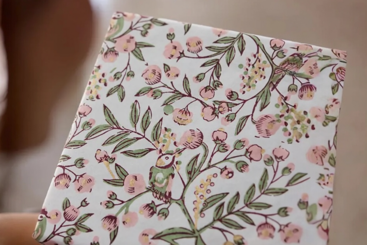 FINCHCRAFT Songbirds Blush cotton wrapping paper featuring hand-block printed birds and floral branches in pink and green